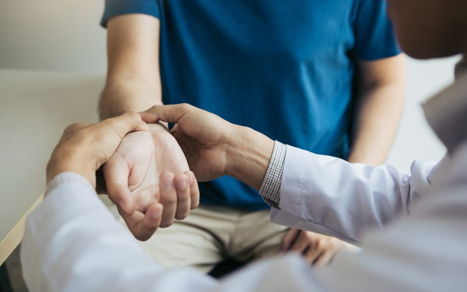 Provider checks a patient's wrist