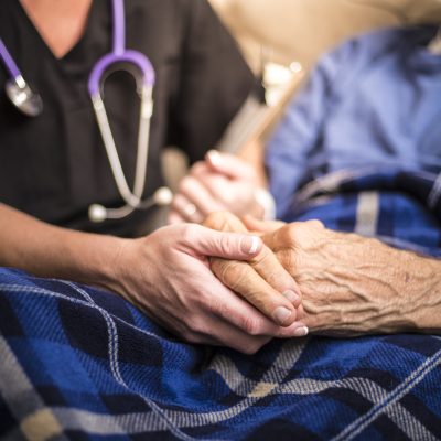 Hospice Nurse visiting an elderly male patient