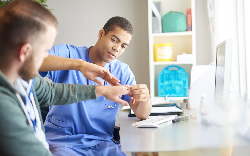 examining patients hand