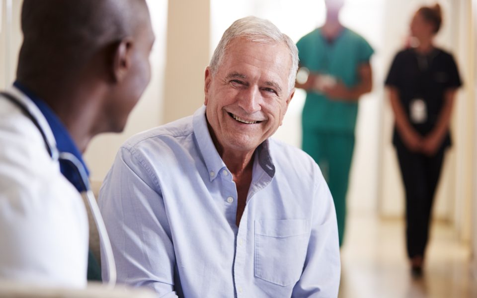 Doctor talking with senior patient.