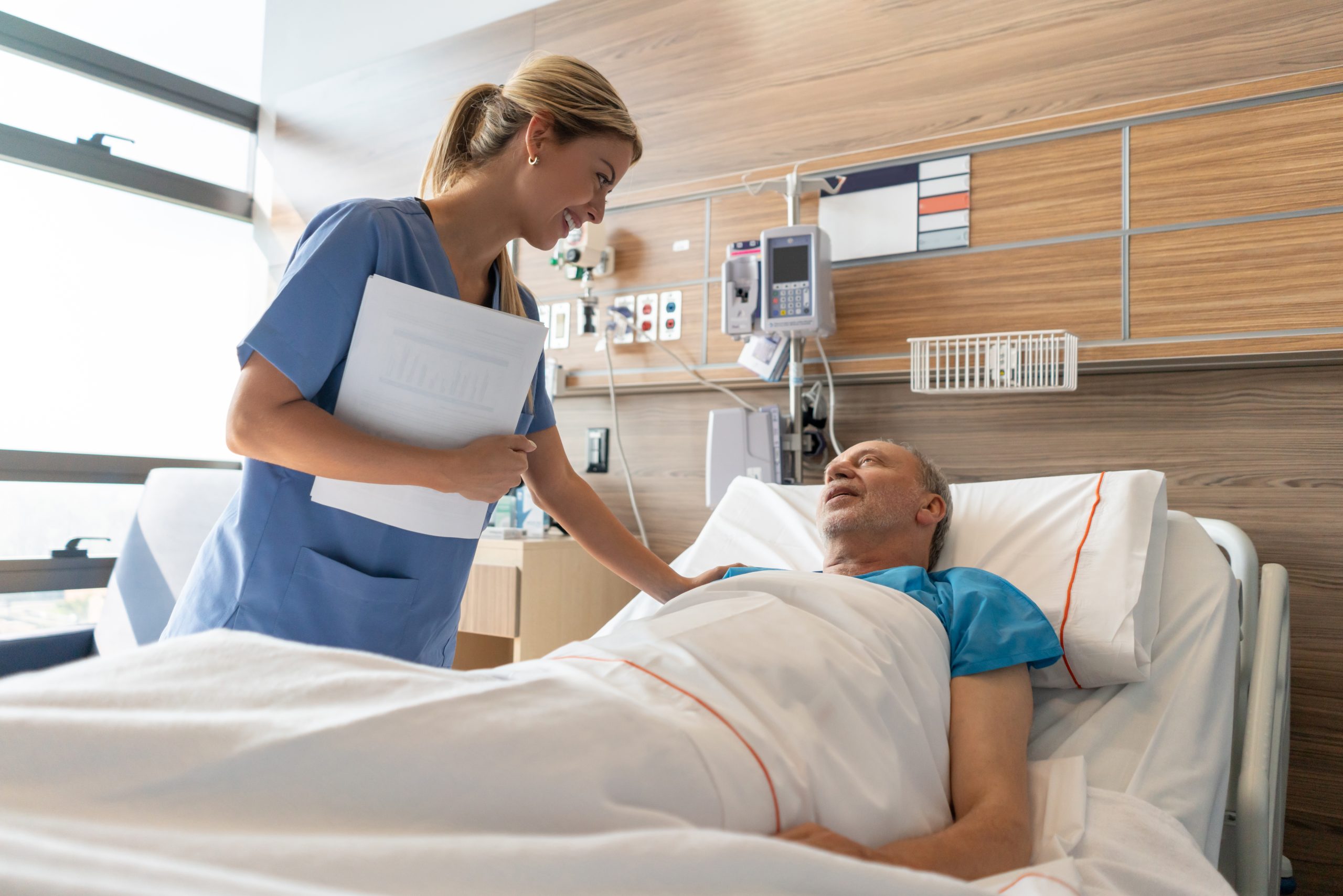 Latin american beautiful doctor checking on senior patient lying down ...