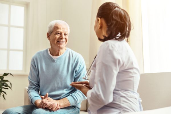 Physician talking with patient