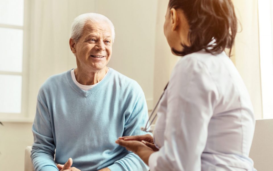 Physician talking with patient