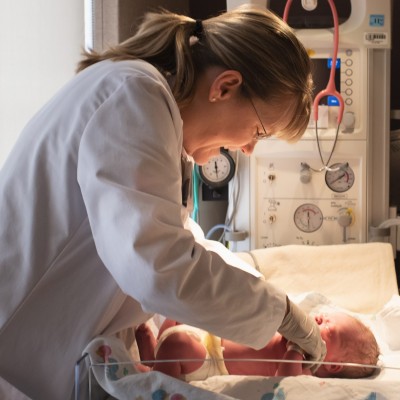 Pediatrician, Dr. Robertson with newborn