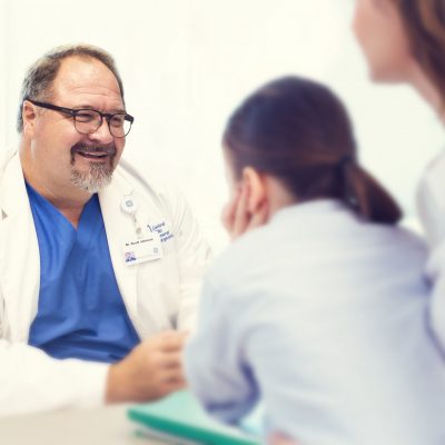 Surgeon speaking with patients