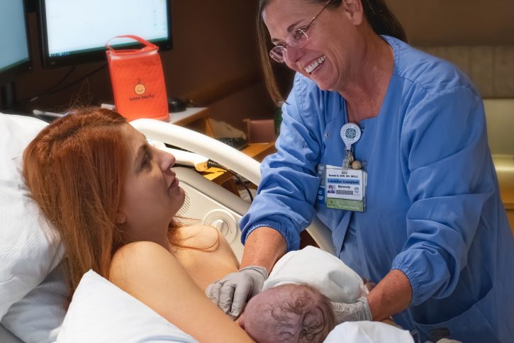 breastfeeding mom with lactation consultant