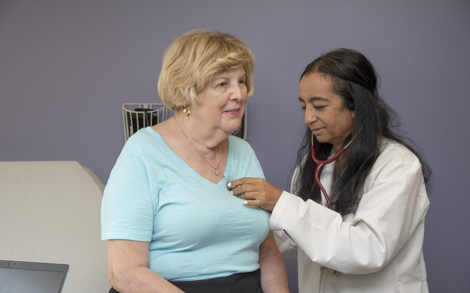 Dr. Saha examining a patient