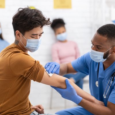 Young man receiving a vaccine