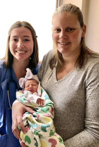 Meagan Lane (right) and Haley Moku, RN, with Sydney.
