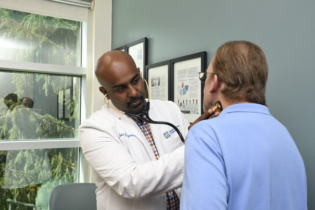 Dr. Lazarus with a patient