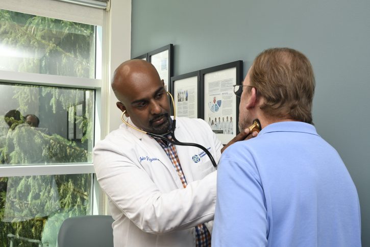 Dr. Lazarus with a patient