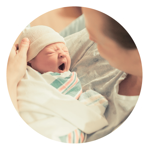 Cute sleepy baby. Mother holding her new born baby boy in her arms. 